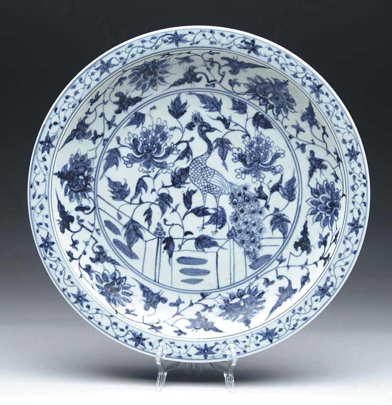 Appraisal: BLUE AND WHITE ORIENTAL CHARGER Decoration with blue peacock flowers