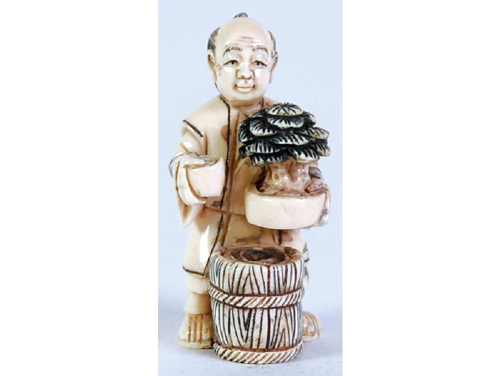 Appraisal: TWENTIETH CENTURY JAPANESE CARVED STAINED AND INCISED IVORY NETSUKE of