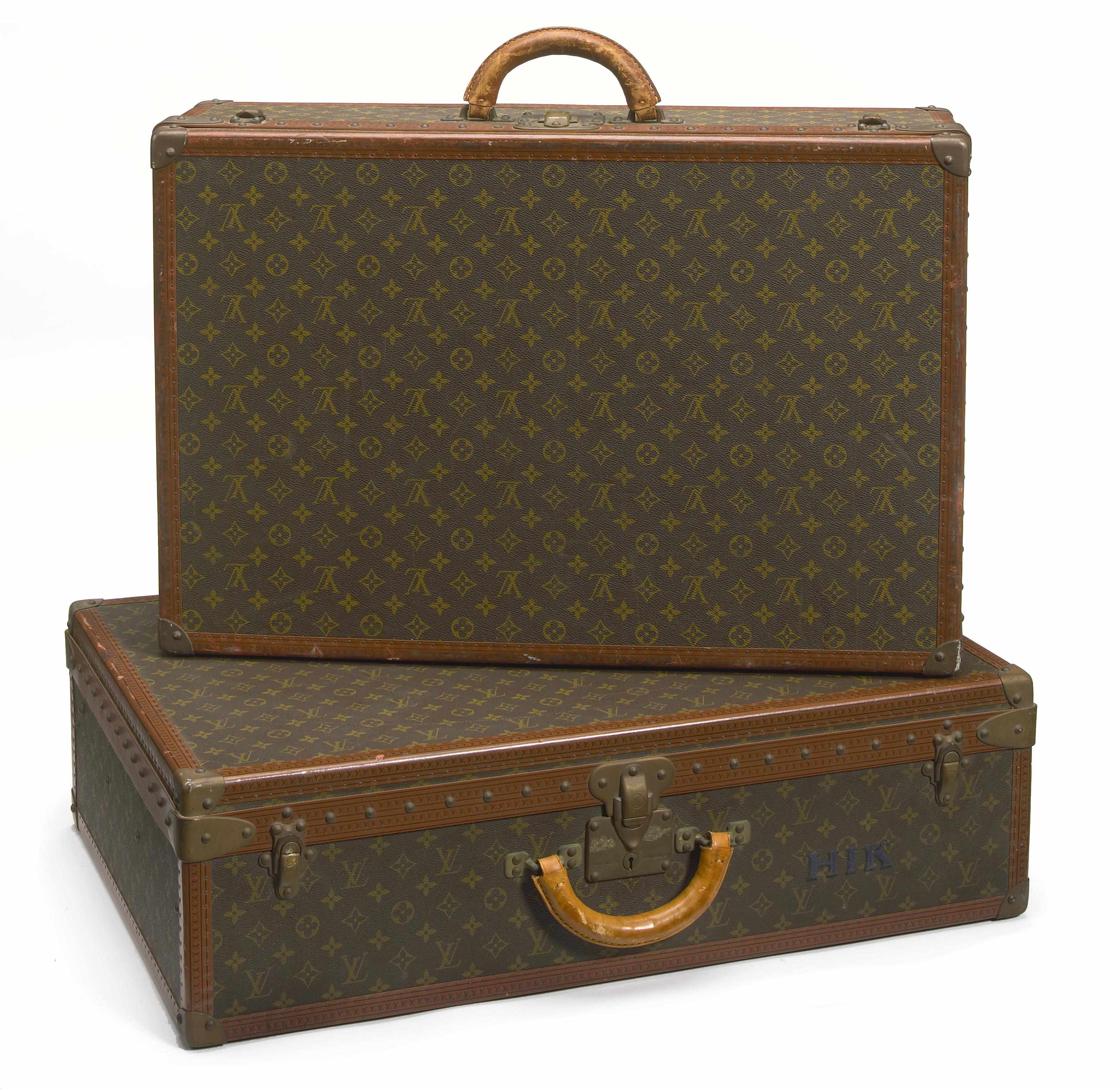 Appraisal: A Louis Vuitton hard side suitcase retailed by Saks Fifth