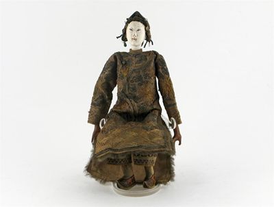 Appraisal: A Chinese doll with a porcelain head wearing a silk