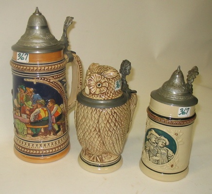 Appraisal: A GROUP OF THREE GERMAN POTTERY BEER STEINS the largest