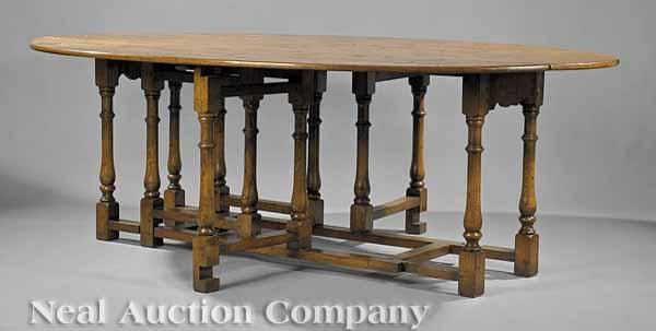 Appraisal: A Large George III Style Oak Wake Table oval drop-leaf