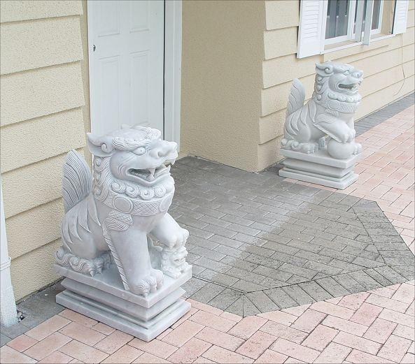 Appraisal: PAIR OF LARGE CARVED MARBLE FOO DOGS Measures '' h