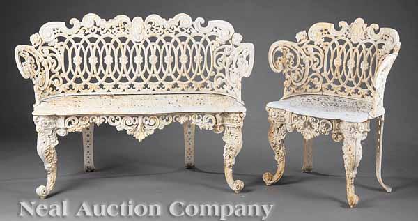 Appraisal: A Victorian Cast Iron Garden Settee and Chair scrolled crest