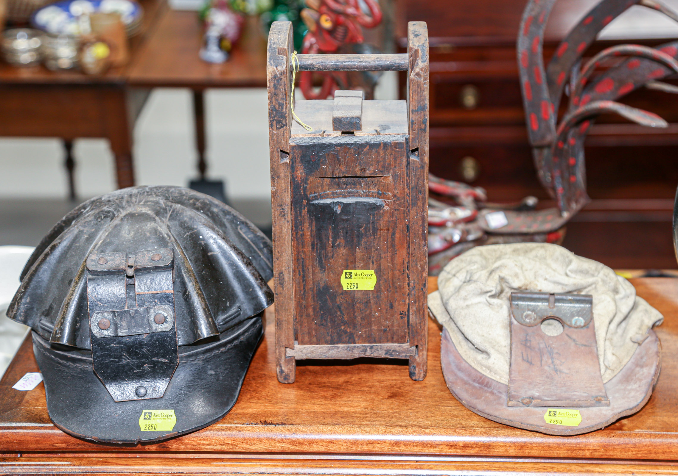 Appraisal: TWO MINERS' HATS A BOX Comprising a leather cap with