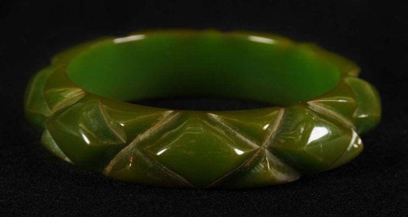 Appraisal: Bakelite Deeply Carved Geometric Green Bracelet Condition Excellent Size -