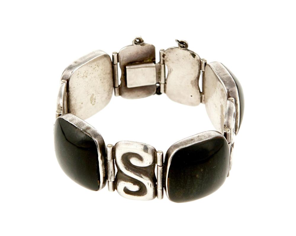 Appraisal: An Enrique Ledesma silver and obsidian bracelet Enrique Ledesma d