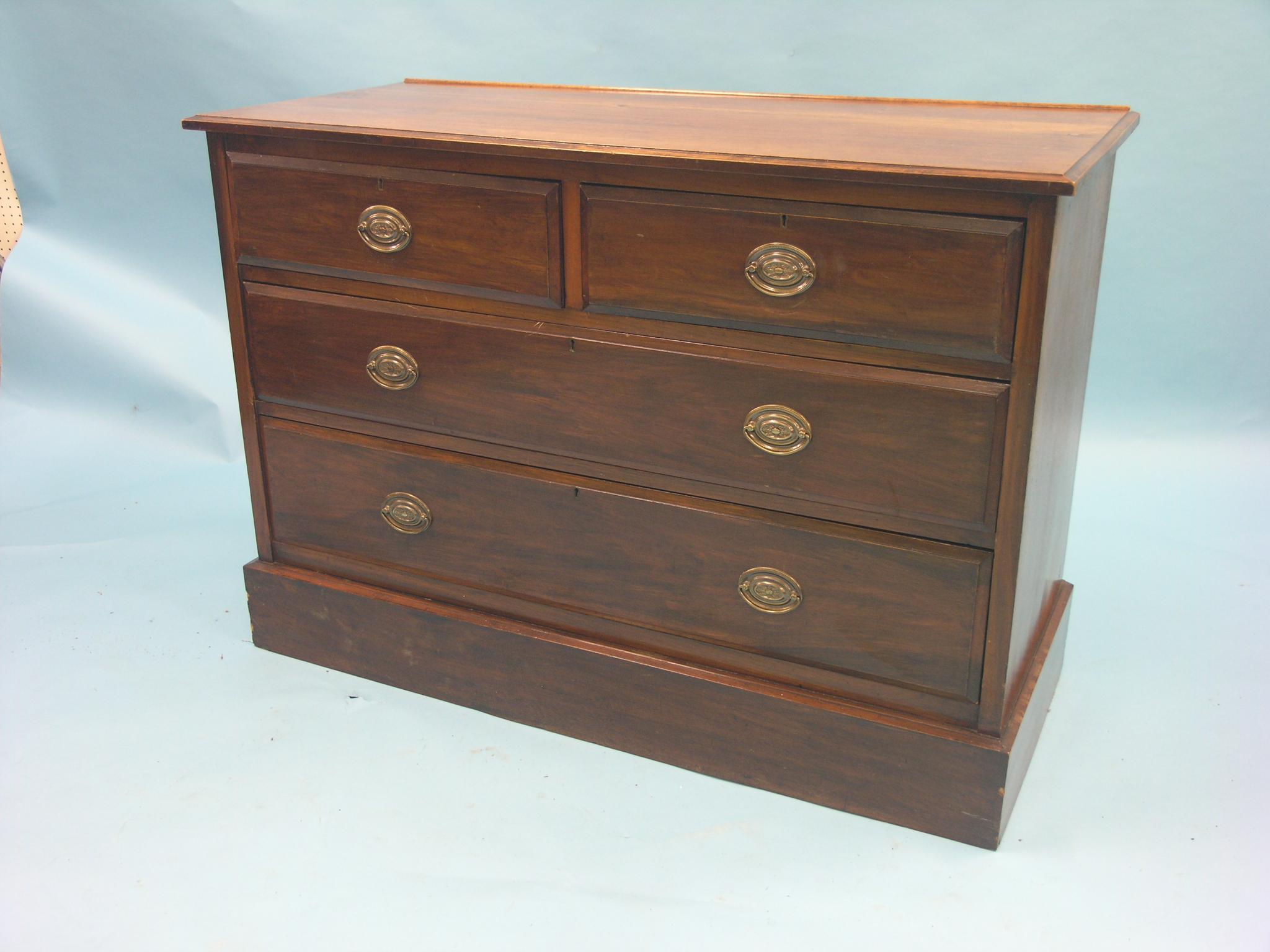 Appraisal: A late Victorian walnut chest two short and two long