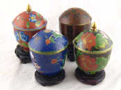 Appraisal: A set of four covered cloisonne enamelled vases with covers