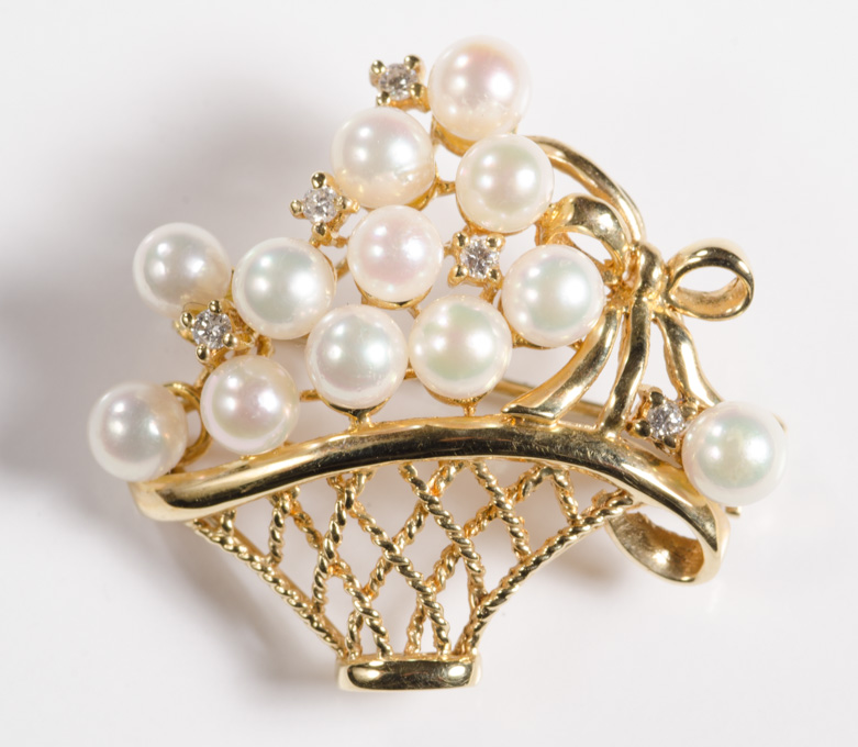 Appraisal: PEARL DIAMOND AND FOURTEEN KARAT GOLD BROOCH a gold basket-form