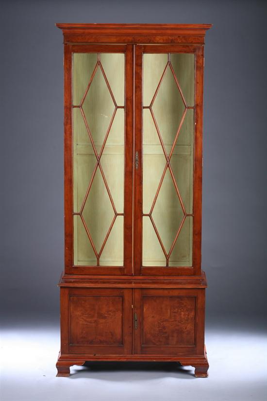 Appraisal: GEORGIAN STYLE YEWWOOD GLAZED-PANEL STEPPED-BACK BOOKCASE ON CABINET th century