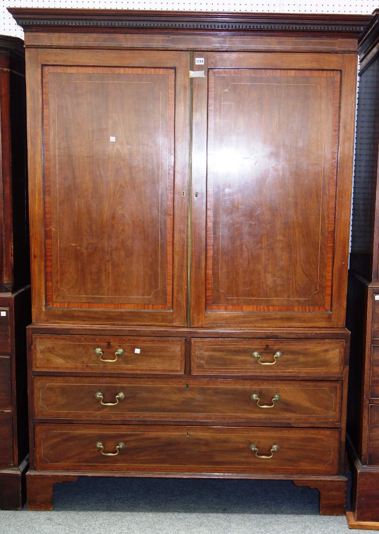 Appraisal: A George III mahogany and satinwood crossbanded linen press with