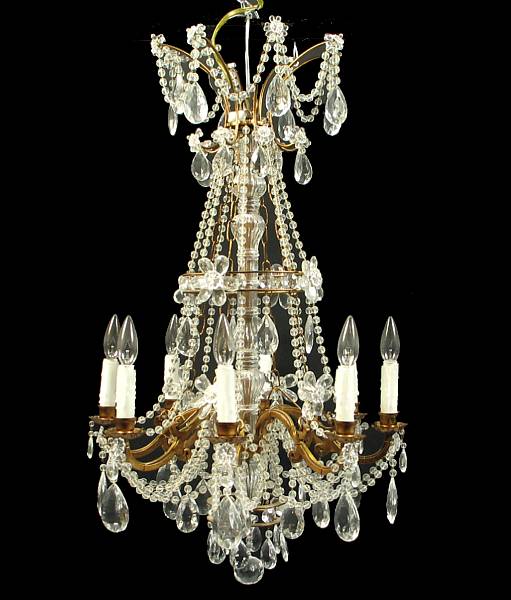 Appraisal: A Louis XV style crystal and bronze eight light chandelier