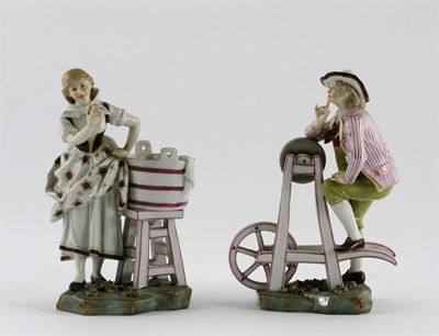 Appraisal: A pair of Continental figures of a knife-sharpener and a