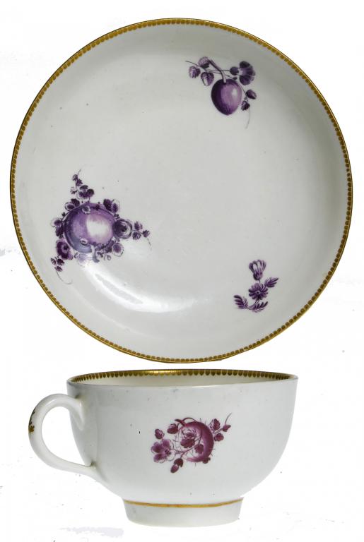 Appraisal: A FIRST PERIOD WORCESTER TEACUP AND SAUCER painted in purple