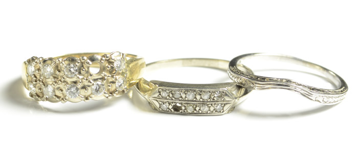 Appraisal: THREE FOURTEEN KARAT GOLD RINGS including a pierced white gold