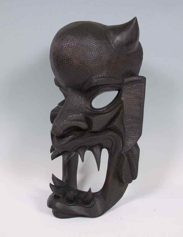 Appraisal: LARGE CARVED AFRICAN MASK Mid th century carved and stippled