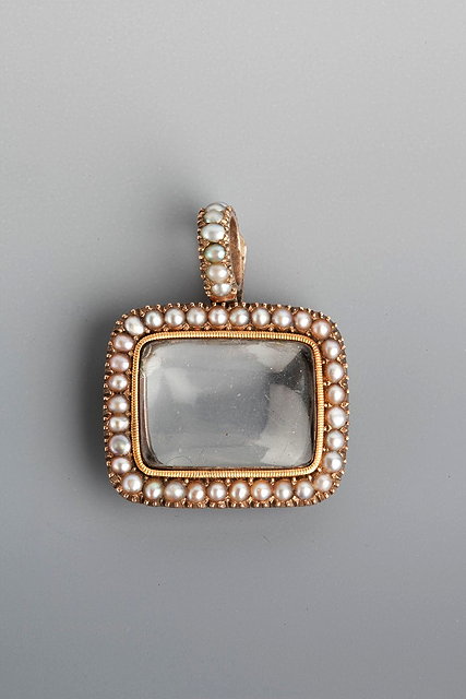 Appraisal: A VICTORIAN PEARL SET RECTANGULAR SHAPED LOCKET with crystal set