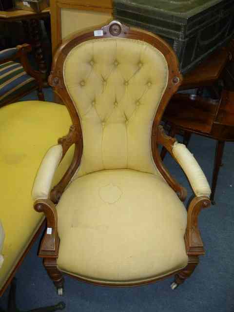 Appraisal: A VICTORIAN BUTTON BACK UPHOLSTERED ARMCHAIR