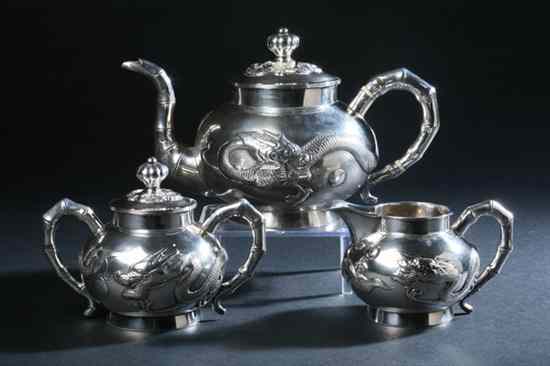 Appraisal: CHINESE SILVER THREE-PIECE TEA SET maker's mark Ruiji Comprising a