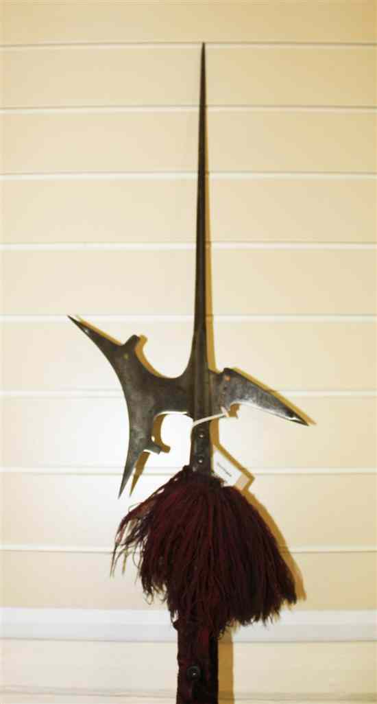 Appraisal: A continental polearm halberd head with tall spike the pierced