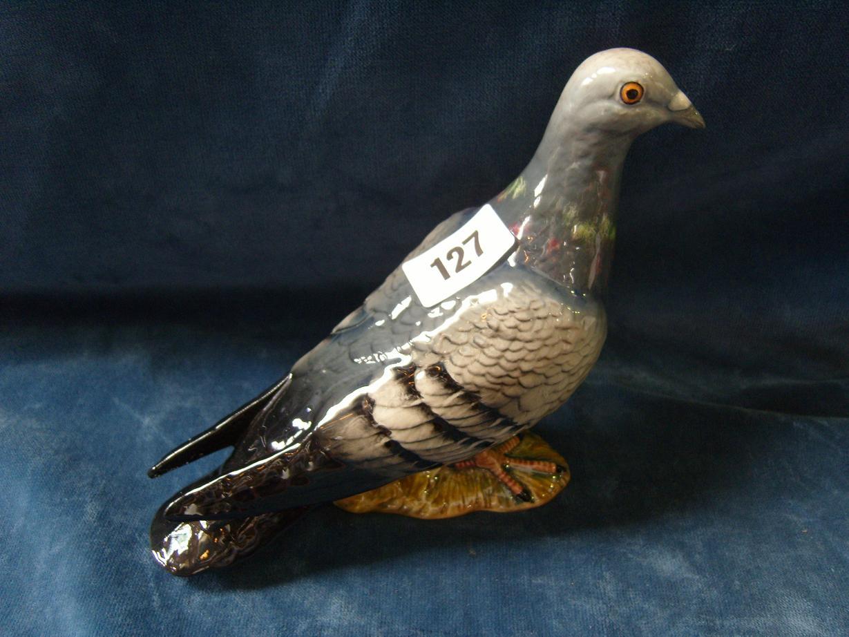 Appraisal: A Beswick model of a racing pigeon with three stripes