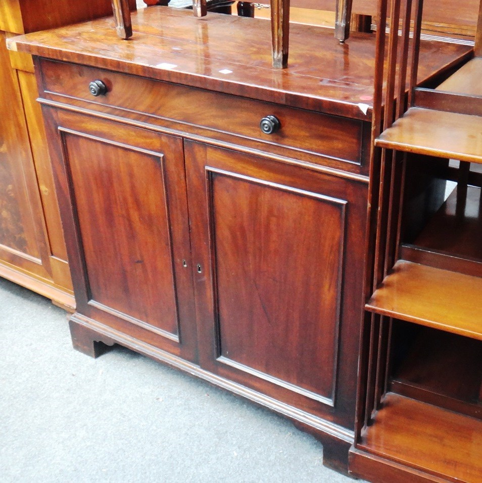 Appraisal: A George III mahogany side cabinet with dummy frieze front