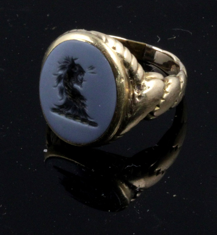 Appraisal: A hardstone set signet ring the oval hardstone intaglio carved