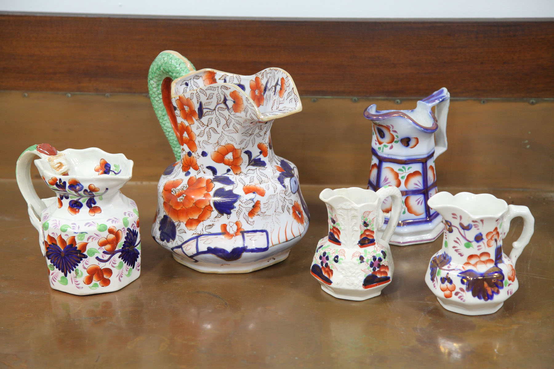 Appraisal: FIVE GAUDY IRONSTONE CHINA PITCHERS English mid to late th