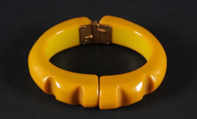 Appraisal: Bakelite Dark Yellow Hinged Bracelet Condition Excellent Size W