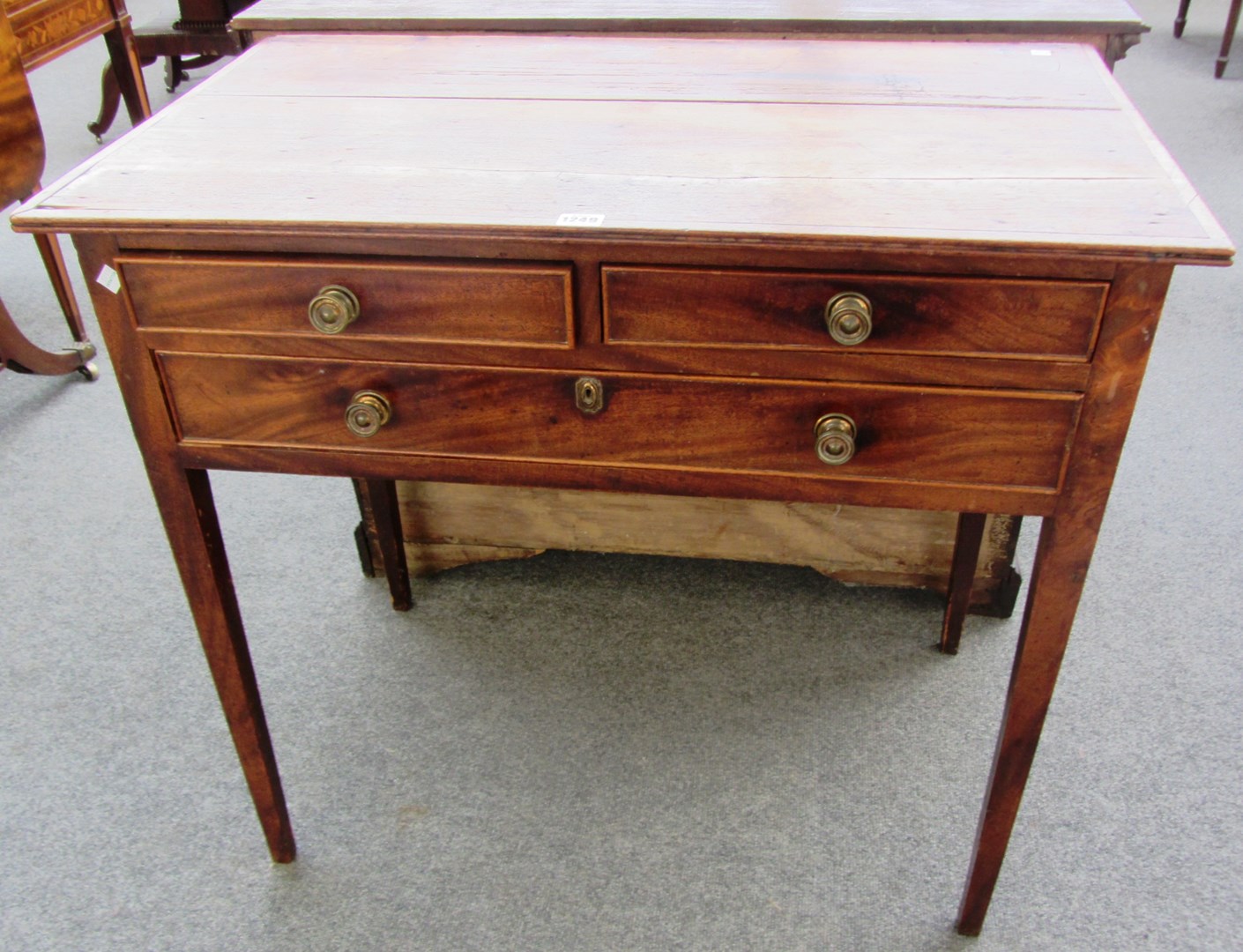 Appraisal: A George III mahogany and pine three drawer side table