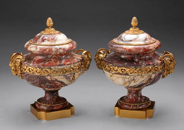 Appraisal: A pair of Louis XVI style gilt bronze mounted marble