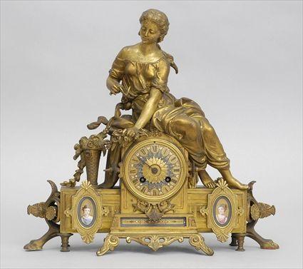 Appraisal: RENAISSANCE-STYLE PORCELAIN-MOUNTED GILT-METAL MANTEL CLOCK The jeweled porcelain dial set