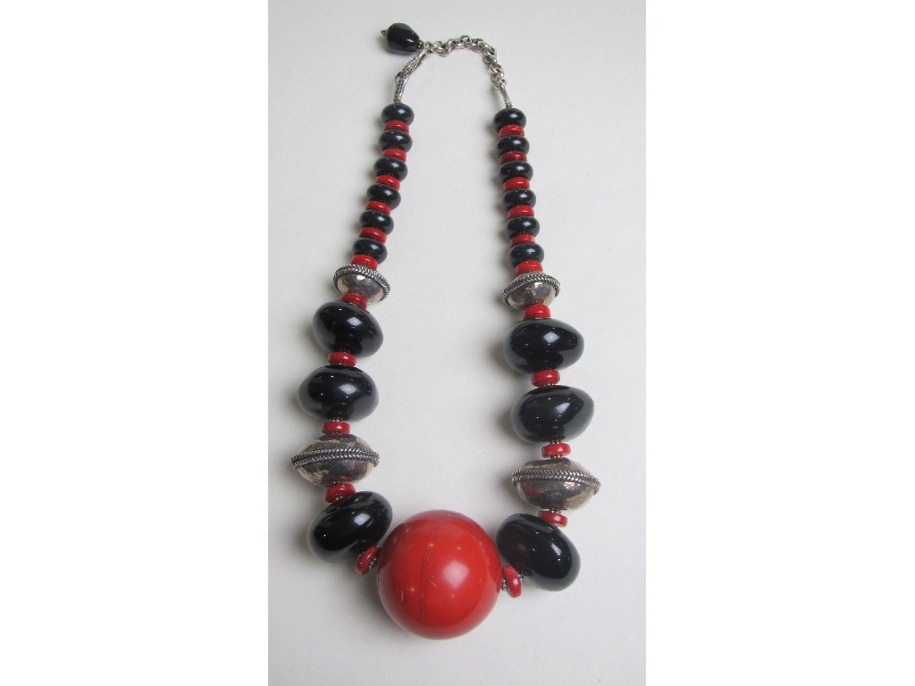 Appraisal: Heavy bead necklace with graduated alternating black beads and red