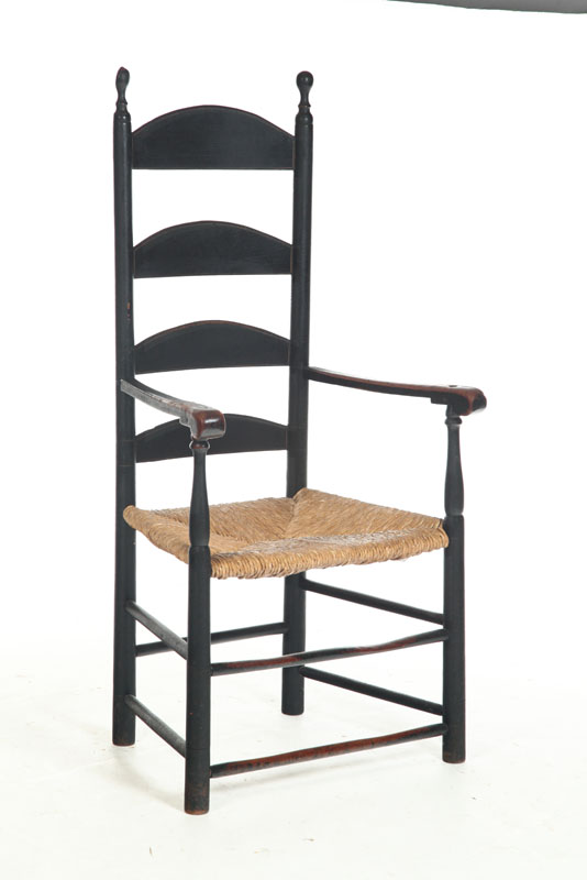 Appraisal: LADDERBACK ARMCHAIR American late th century mixed woods Old black