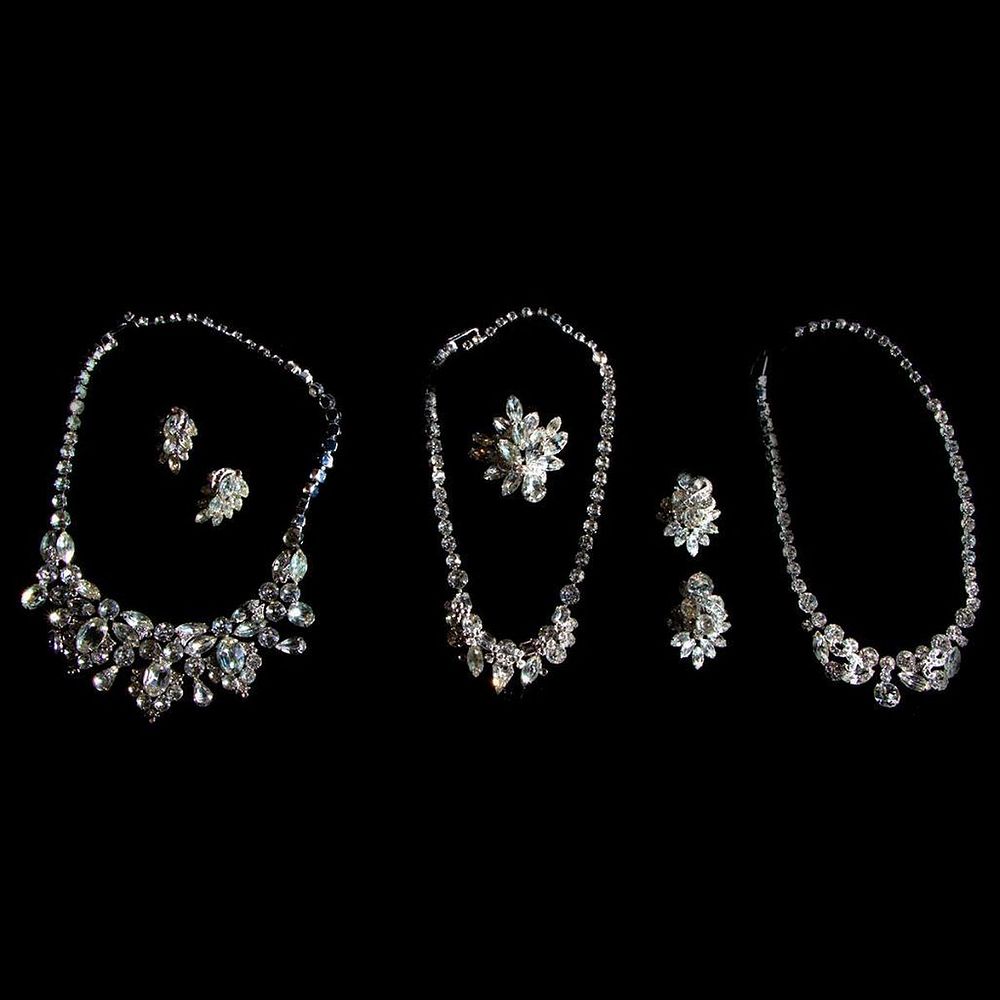 Appraisal: Eisenberg rhinestone jewelry necklaces one brooch and pairs of earrings