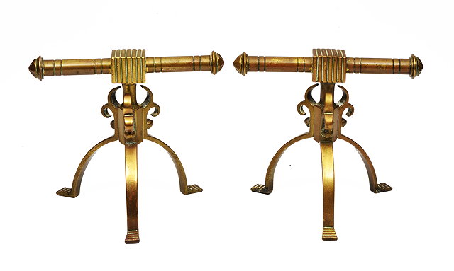 Appraisal: A PAIR OF AESTHETIC STYLE CAST BRASS FIRE IRON RESTS