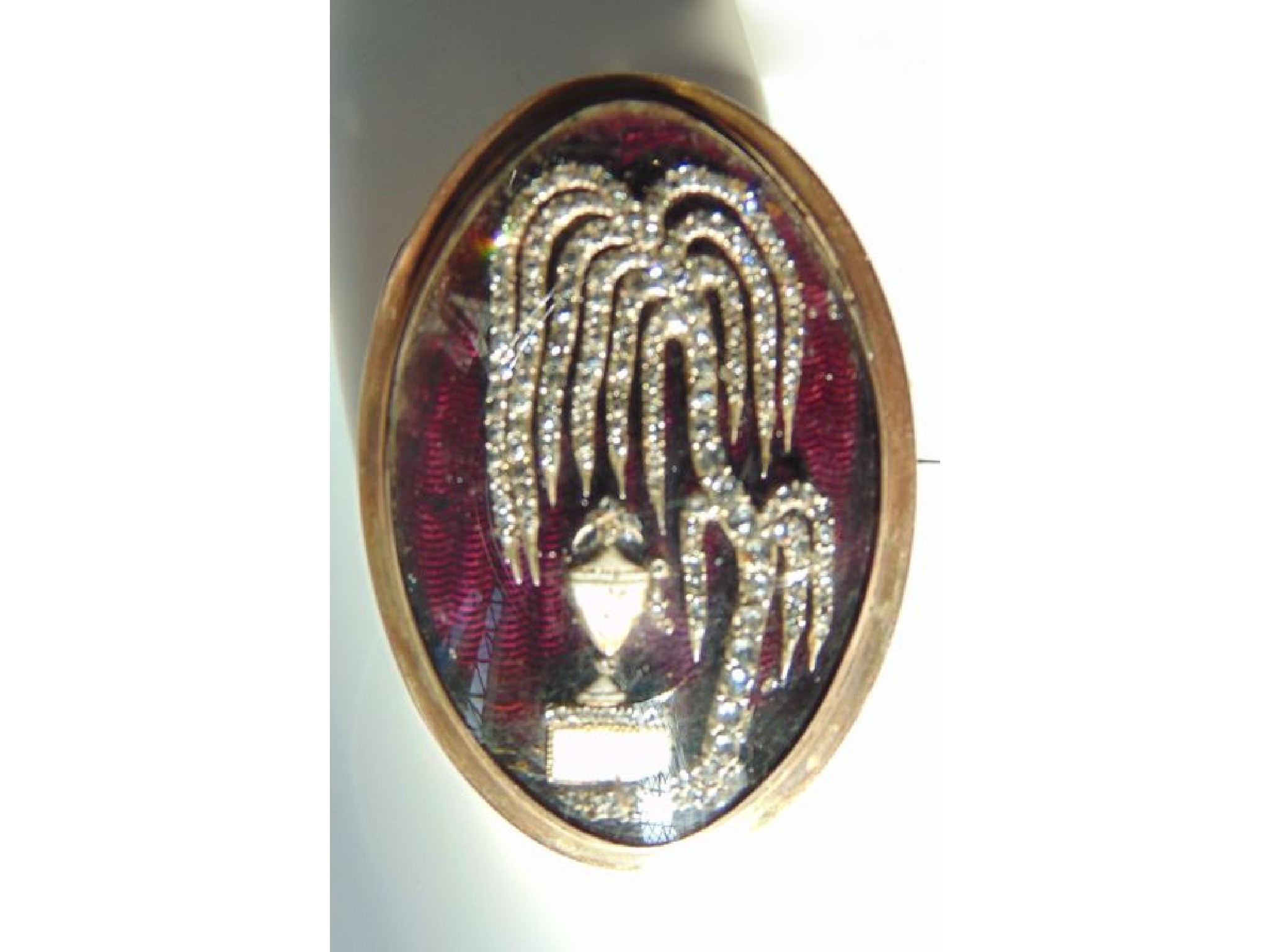 Appraisal: A Georgian mourning clasp of oval form the purple guilloche