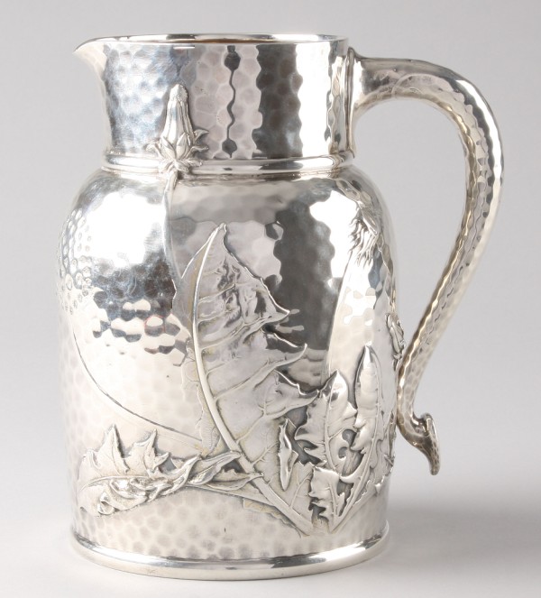 Appraisal: Pitcher features dandelion and butterfly motif marked on base Tiffany