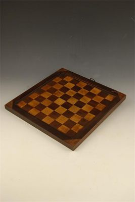 Appraisal: A rosewood bordered reversible games board inlaid a chequerboard and