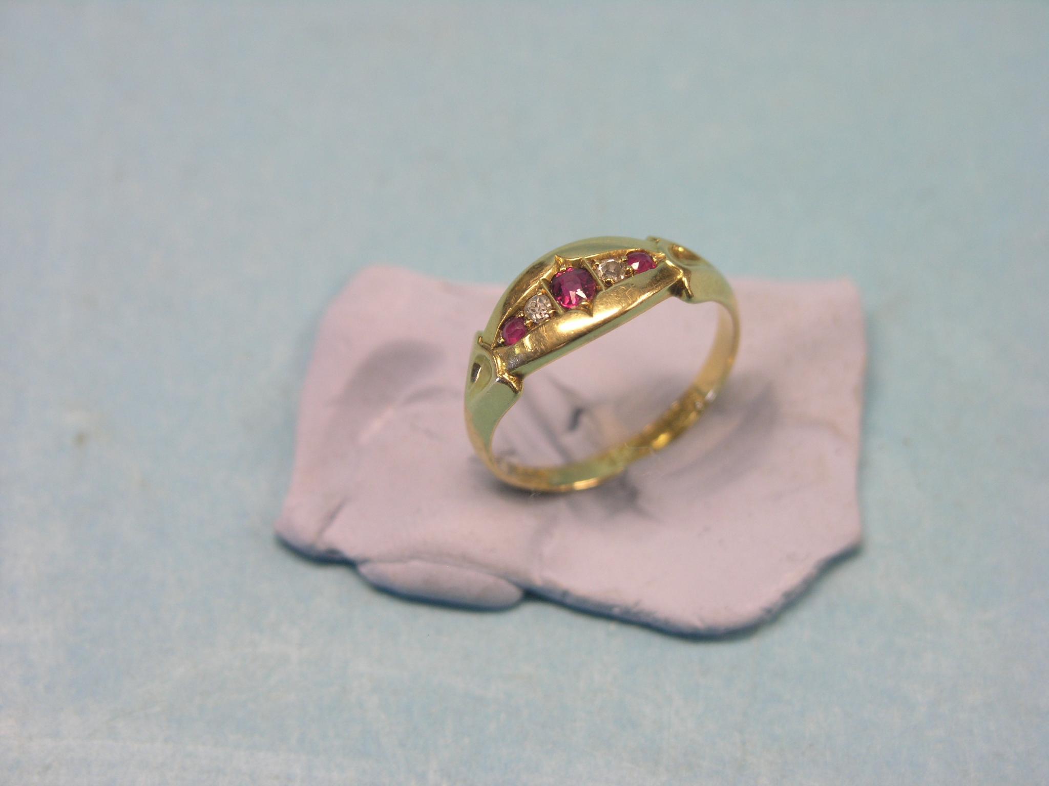 Appraisal: An ct gold half-hoop ring set three rubies and two