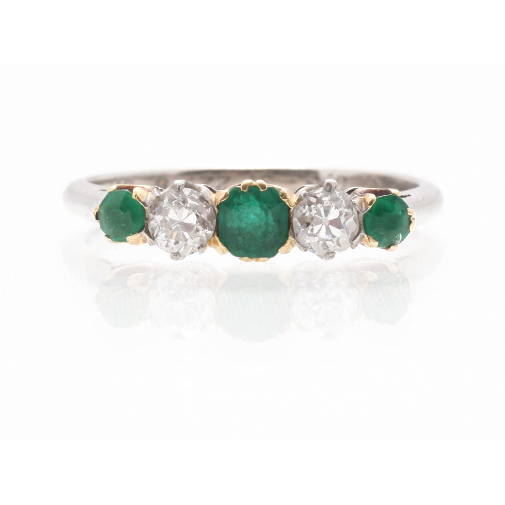 Appraisal: A five stone emerald and diamond set ring claw set