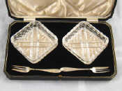 Appraisal: A pair of cut glass dishes with silver forks in