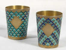 Appraisal: Russian Interest A pair of silver gilt and enamel beakers