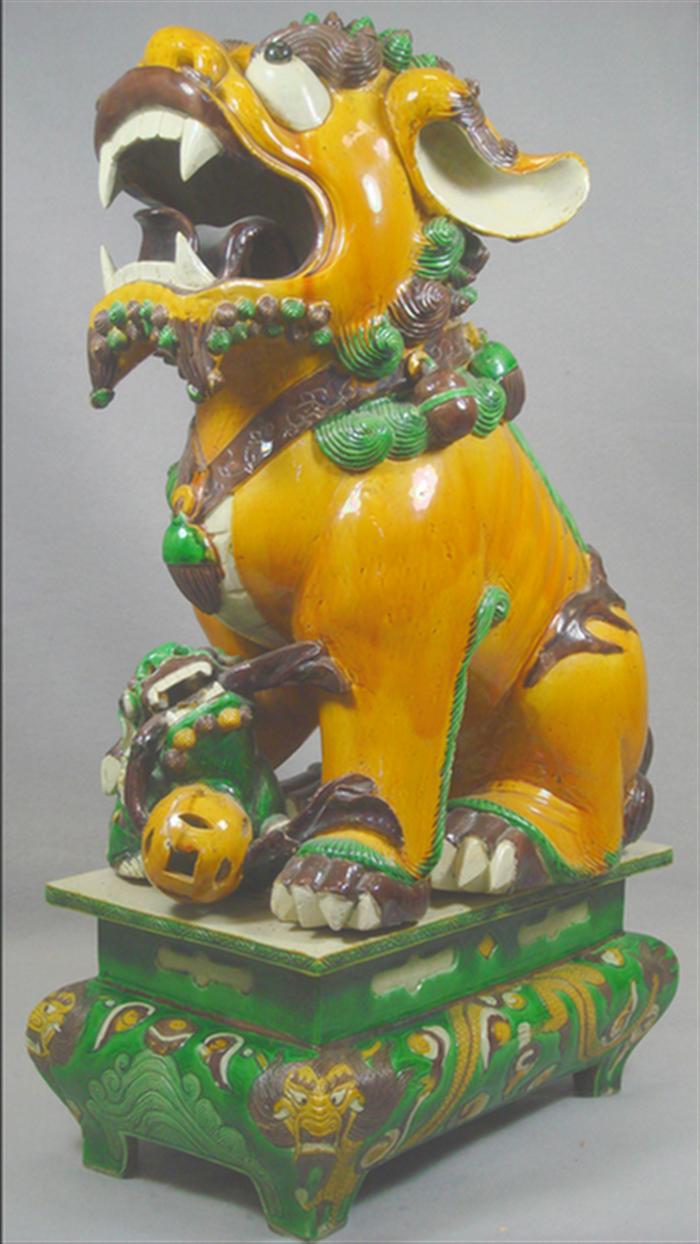 Appraisal: Chinese pottery foo dog on pedestal h Estimate -