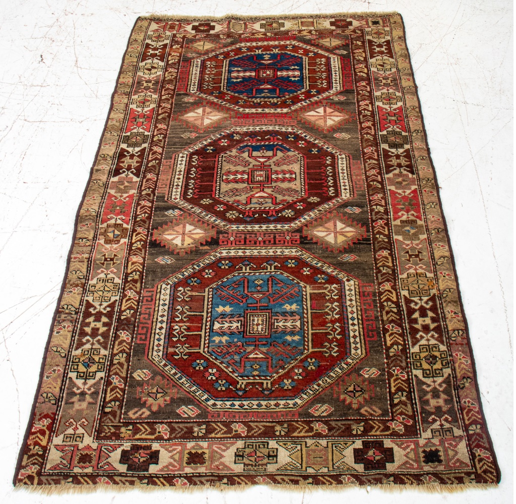 Appraisal: CAUCASIAN KAZAK GEOMETRIC PATTERN RUG Caucasian Kazak hand-knotted rug with