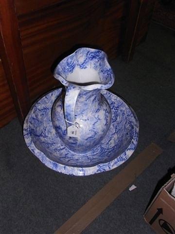 Appraisal: A STAFFORDSHIRE BLUE AND WHITE POTTERY TOILET JUG and bowl