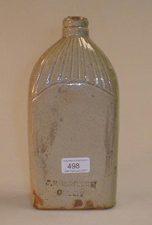 Appraisal: A thC stoneware slab signed flagon with fluted canopied shoulders