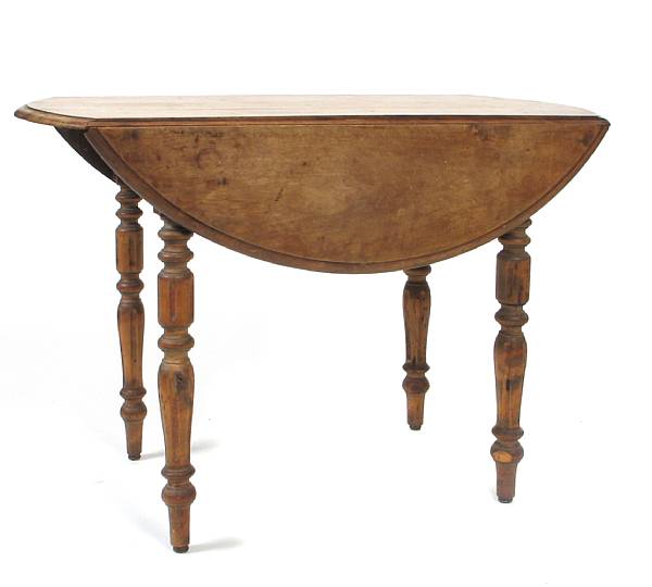 Appraisal: A Continental fruitwood drop flap breakfast table wear height in