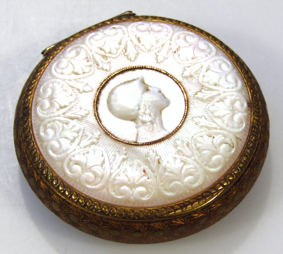 Appraisal: An early thC mother-of-pearl and gilt metal compact the circular